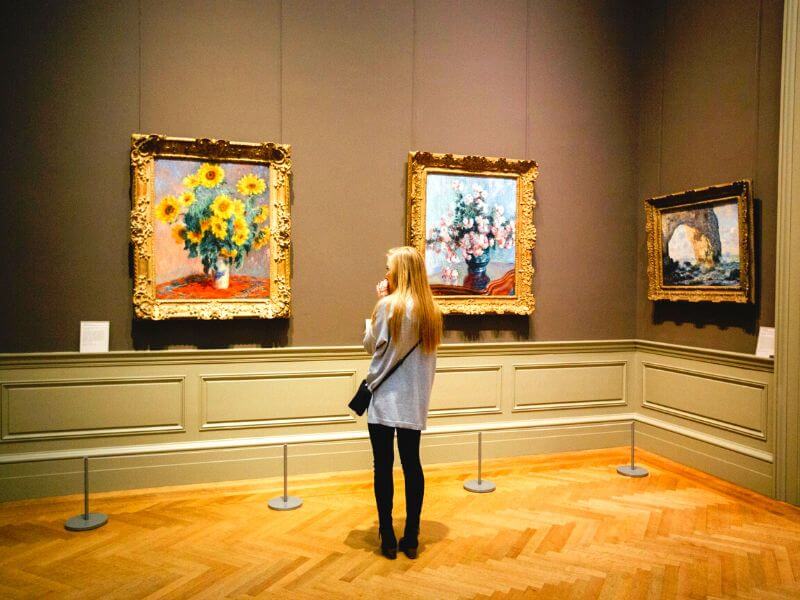 Woman in a museum appreciating art