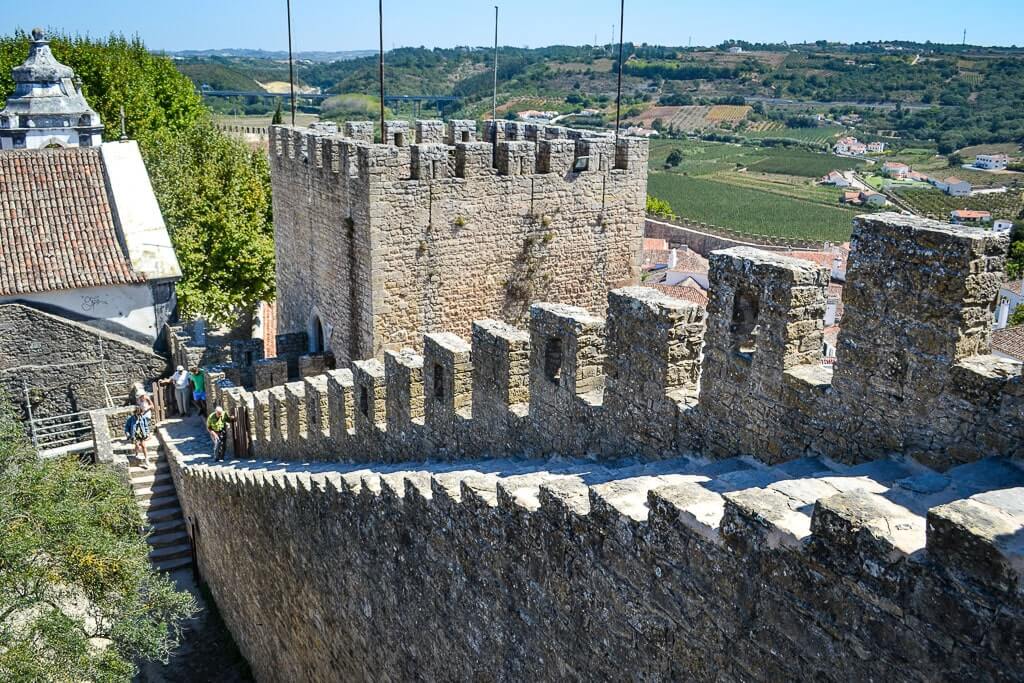 Climbing the fort walls in Obidos Portugal