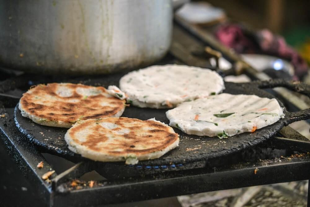 Coconut rotis being prepared at a Hela Bhojhunhala