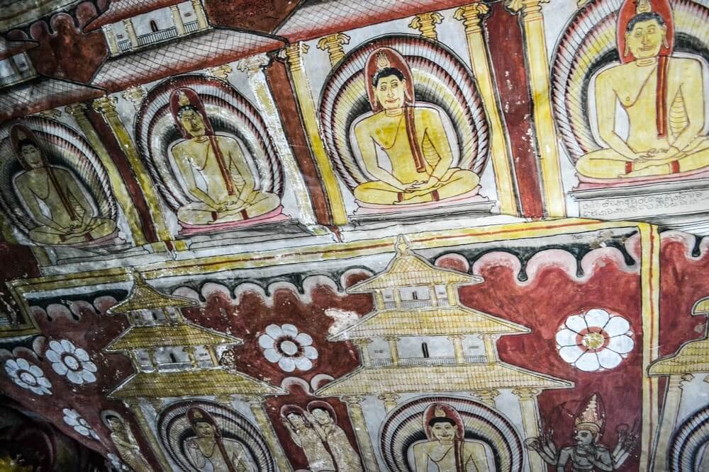 Stunning frescoes adorn the ceilings and walls of the Dambulla caves in Sri Lanka