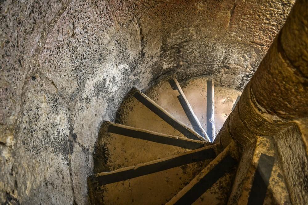 Narrow spiral staircase that leads up to the tower