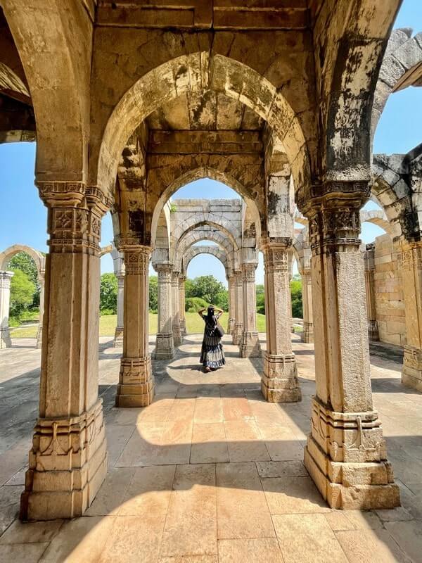 Walking through the archways of Kamani Masjid in Champaner