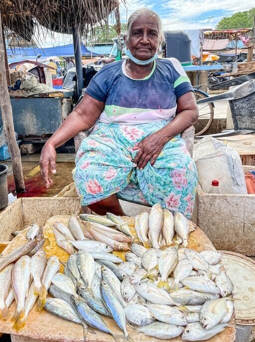 A fisherwoman sells fish in Negombo