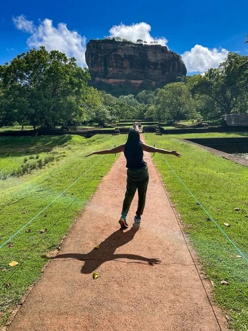 Author walking toward Sigiriya Rock Fortress