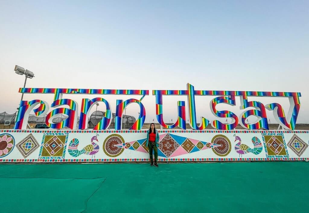 Author in front of Rann Utsav banner