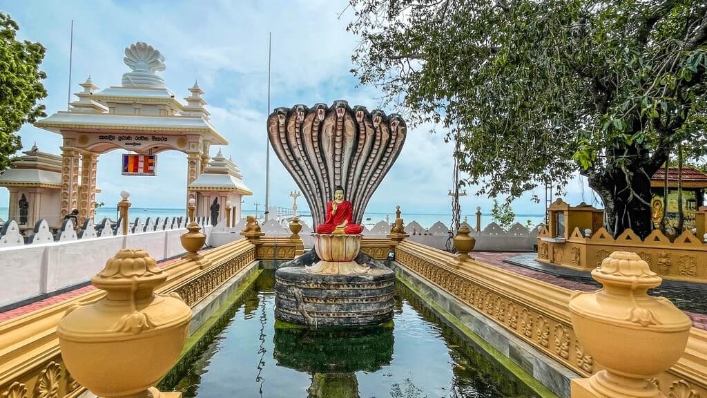 Statue of Buddha under a serpent at Nagadeepa Purana Viharaya