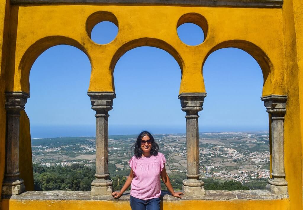 Soumya at the arches of Pena Palace in Sintra