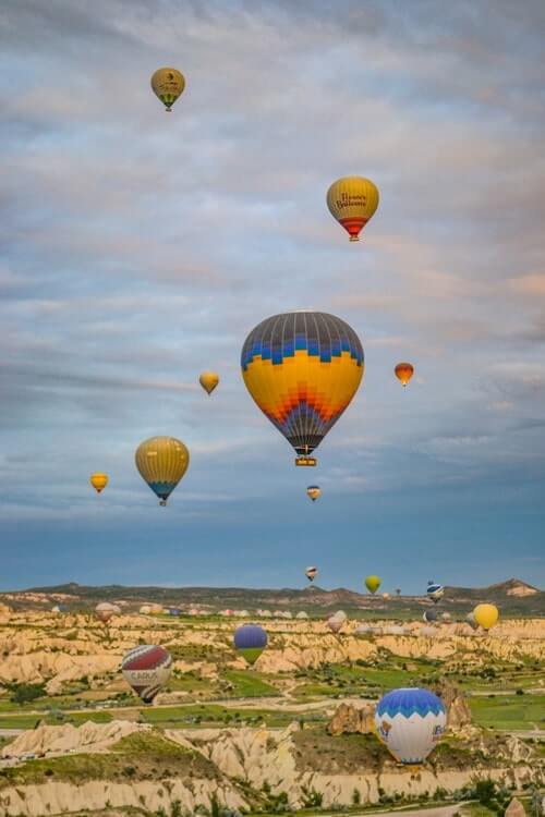 One big balloon and many small ones