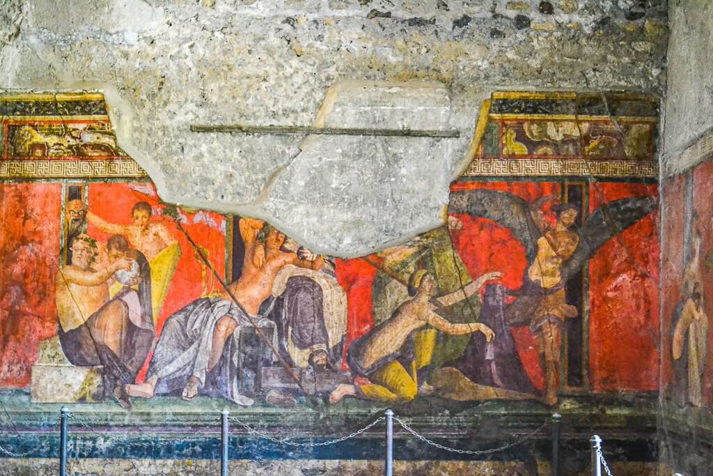 Dionysian frieze at Villa of Mysteries. Frescoes at Pompeii make it absolutely worth a visit.