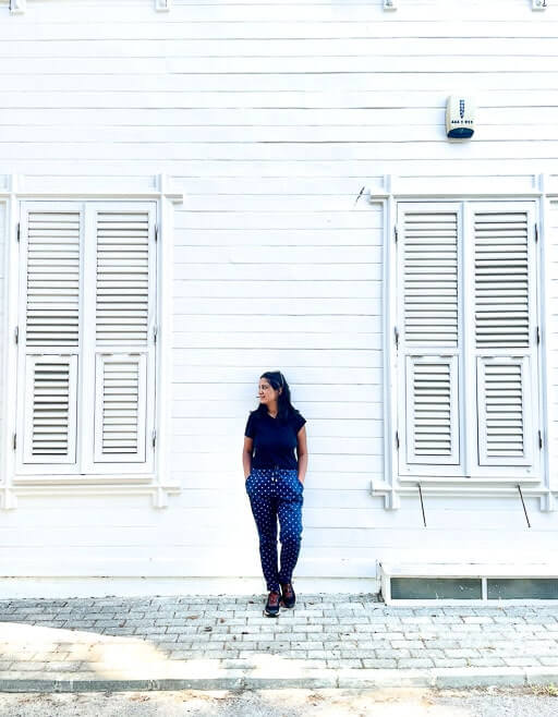 Girl in front of a white house in Buyukada, Turkey