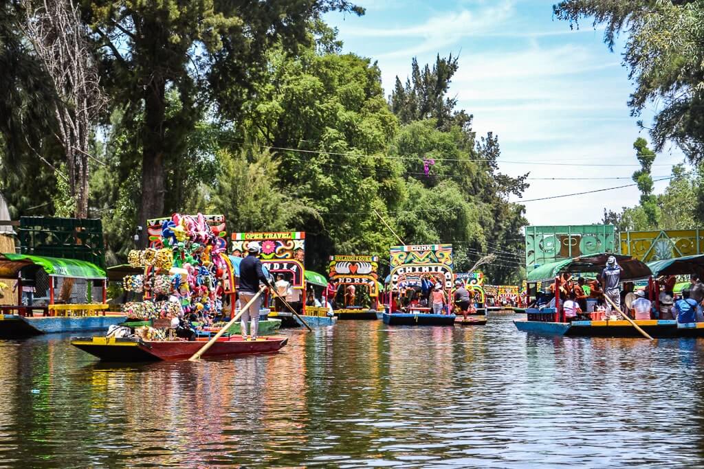 The colorful trajineras (boats) at the floating gardens of Mexico City