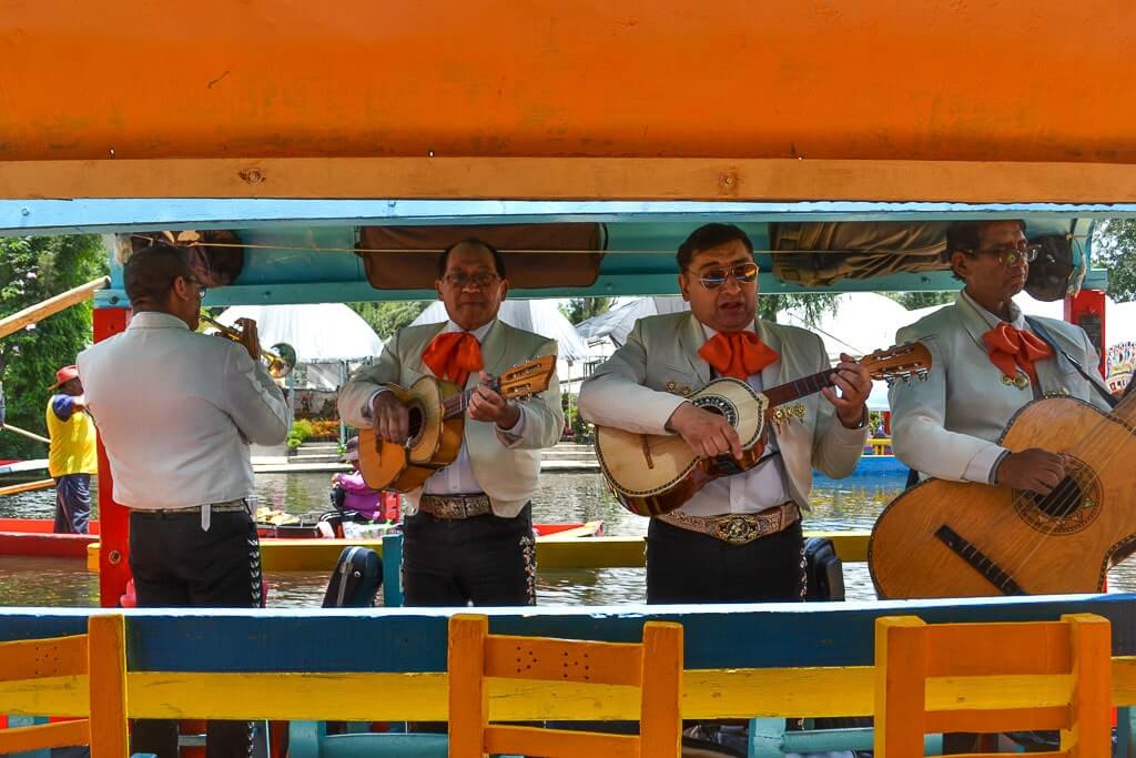 Mariachi band performing Cielito Lindo at Xochimilco