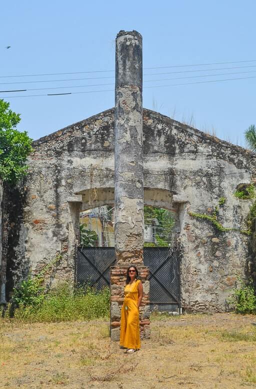 Author standing in front of a pillar at Hacienda San Gabriel de las Palmas