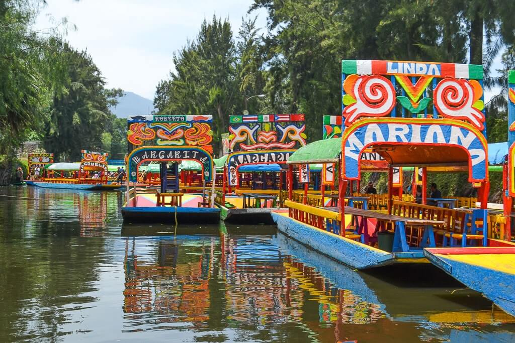 colorful trajineras in Xochimilco, Mexico