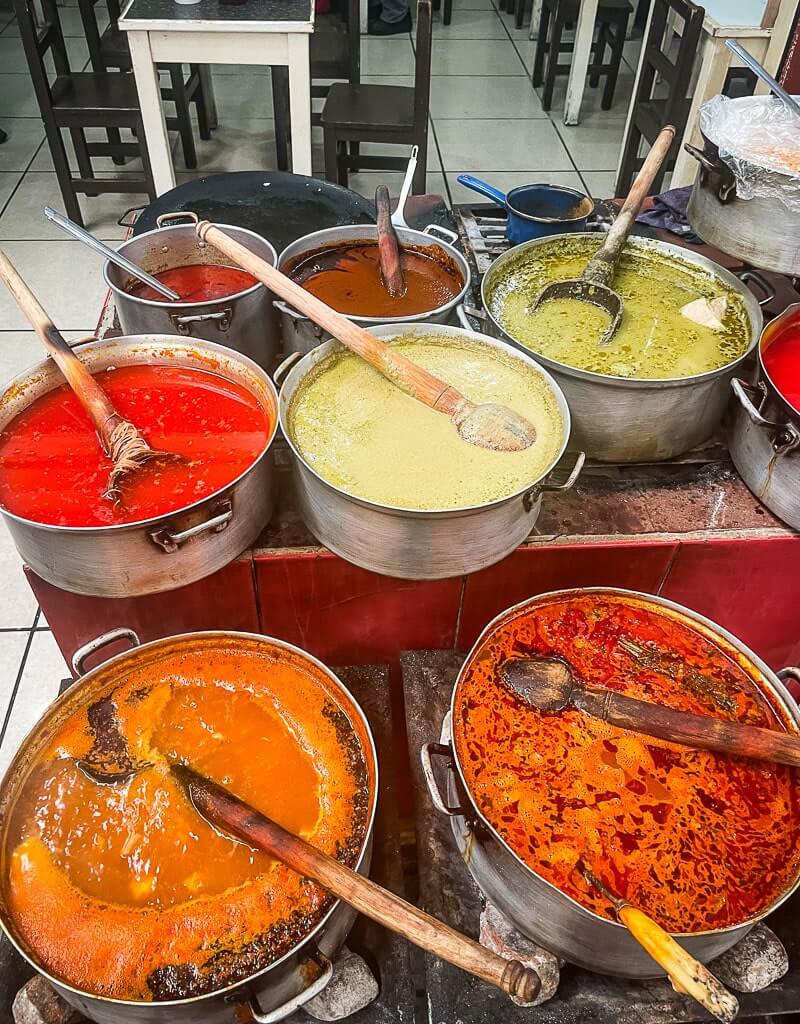 Various kinds of pipian sauces at a local market in Puebla