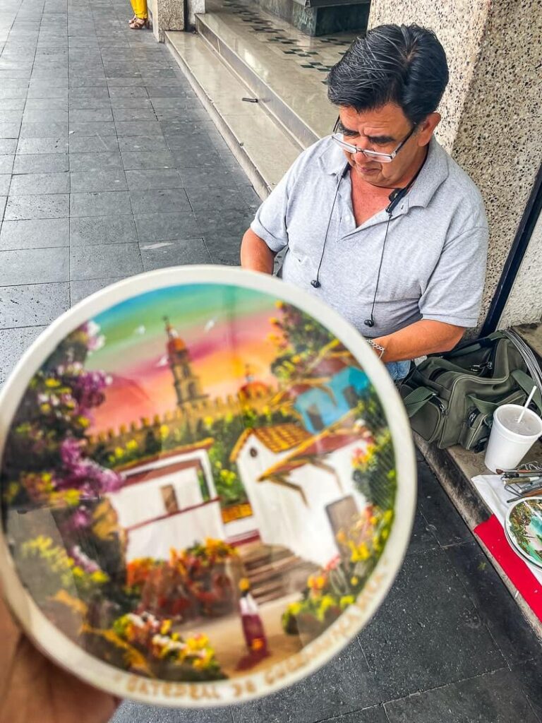 Local artist paints wall plates in Cuernavaca Mexico