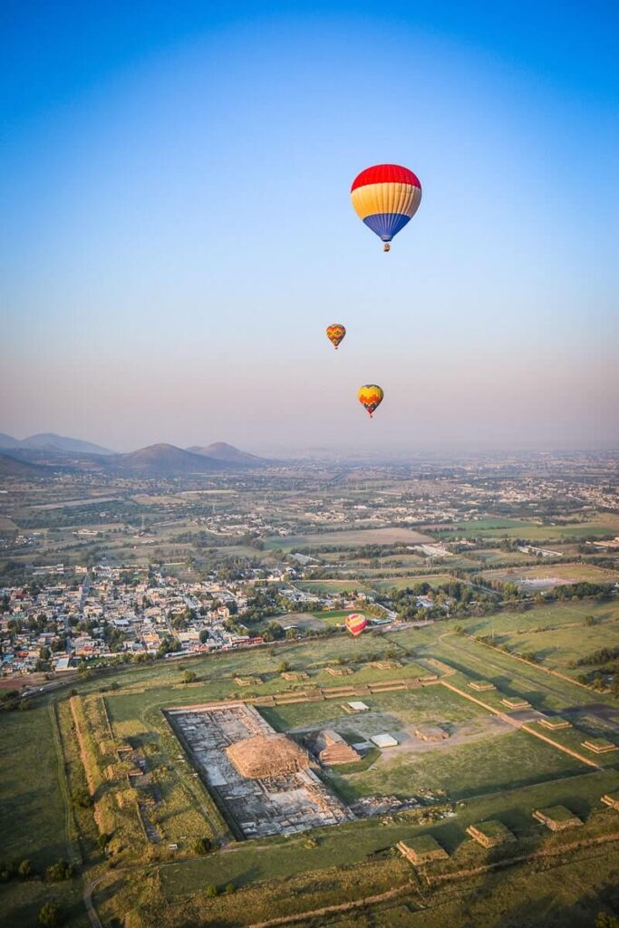 Balloons flying over the Feathered Serpent Pyramid in Teotihuacan