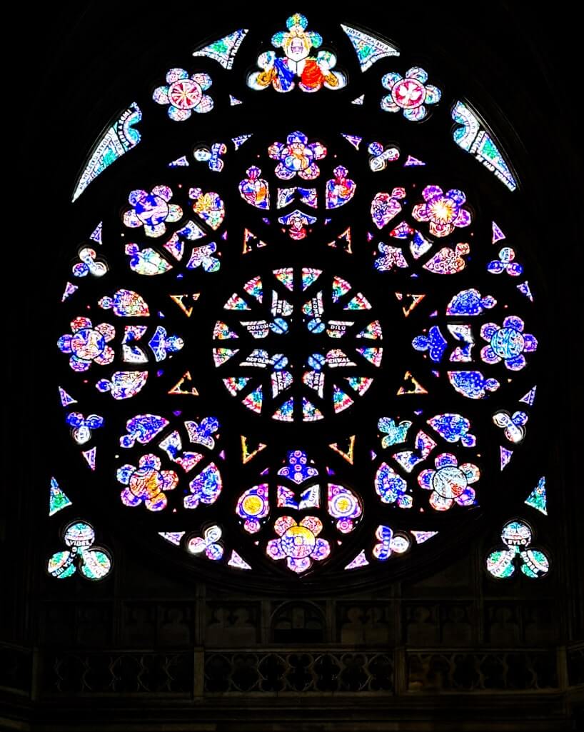 Rose window with stained glass at St. Vitus Cathedral in Prague