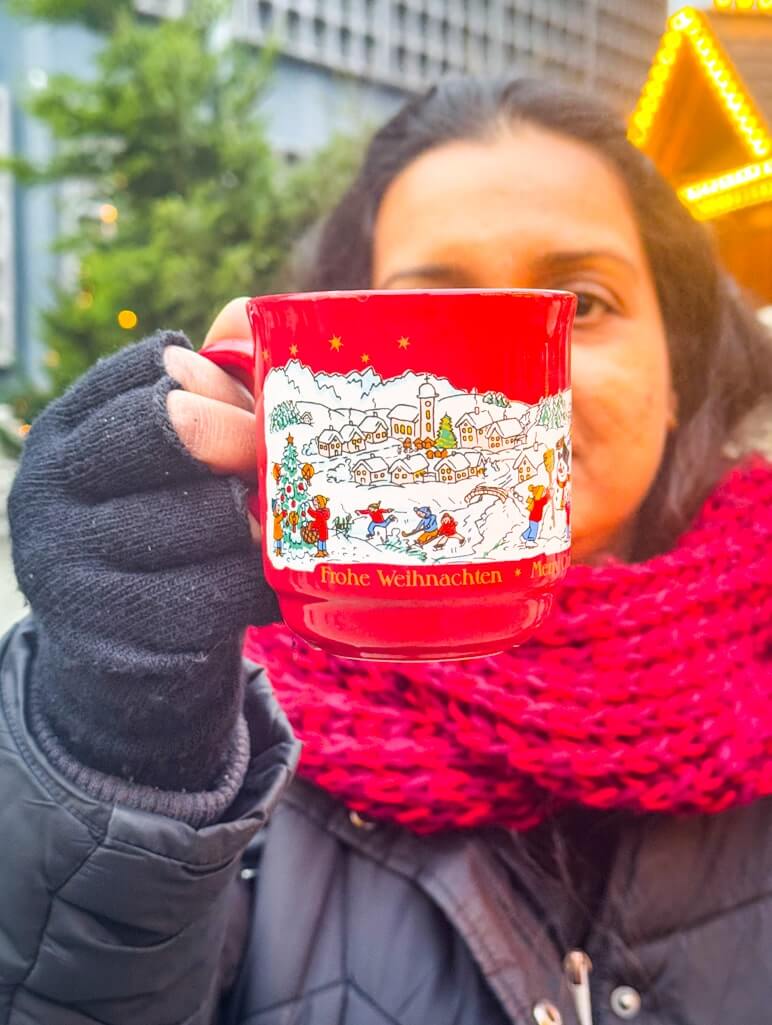 Author with a gluhwein mug in Berlin
